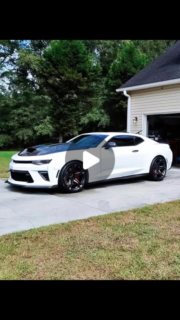 White performance car with a glossy finish after detailing